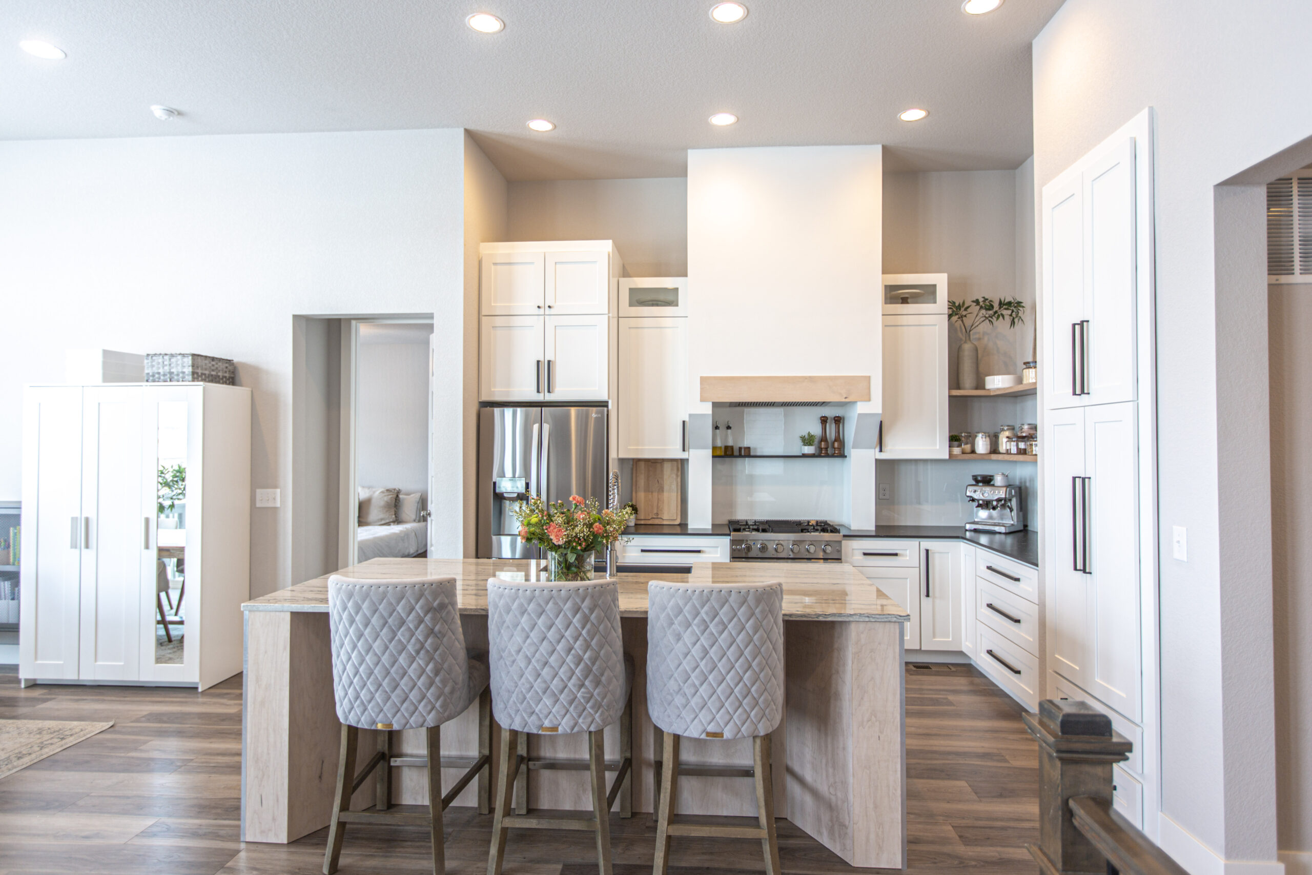 Contemporary white kitchen with custom hood